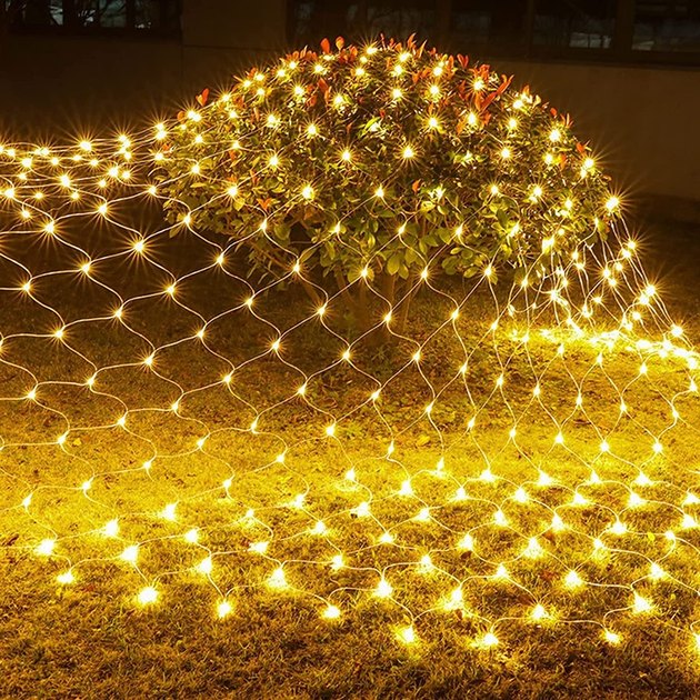 A net of outdoor-friendly Christmas lights that easily cover any large surface — from bushes to trees to fences and beyond.