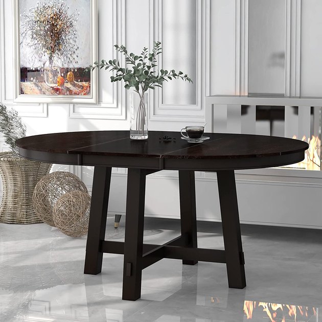 If you entertain every now and then but don't want a large dining room table all the time, consider this extendable model that adds 16 inches of space via a removable leaf.