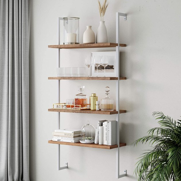 With four levels, this floating bookshelf is well-equipped to hold books, kitchenware, and beyond. Try it in the kitchen or living room for a stylish storage solution.