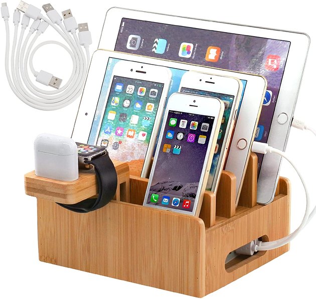 Tidy up your devices while they charge with this bamboo charging station. It has multiple designated compartments for everything from tablets to phones, to smart watches. Made with natural bamboo, it also comes with a five-pack of charging cables for a more sleek and unified look.