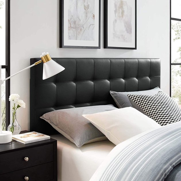 Made with vegan leather, this chic tufted headboard is a total eyecatcher. Not only is it height adjustable, but it’s also made with fiberwood and plywood for added durability.