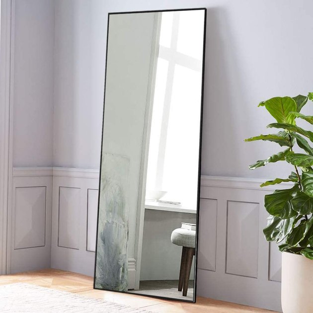 Large and affordable, this full body mirror can brighten up your room as a floor mirror or wall-mounted mirror.
