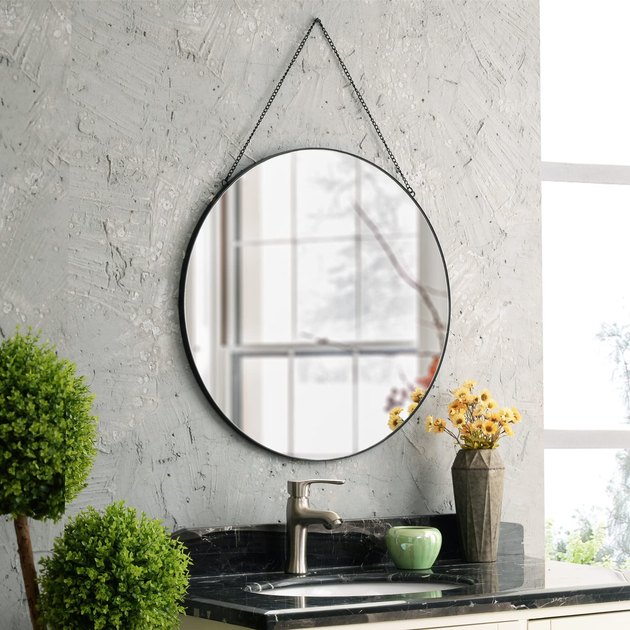 Whether you need a mirror for your bathroom, bedroom, or living room, this option will do the trick. It has a sleek and modern black metal design with a matching hanging chain to match.