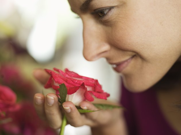Woman smelling flower