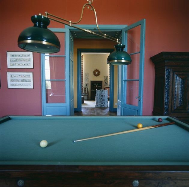 Billiards table in empty room, close-up.