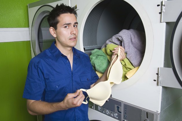 Man holding bra