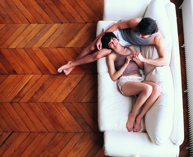 Overhead View of a Young Couple Relaxing on a Sofa