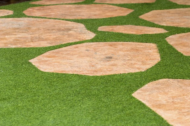 Pathway of stone bricks on grass