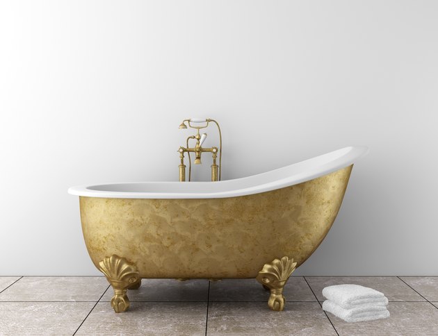 classic bathroom with old bathtub and white wall
