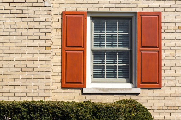 Traditional window with wooden shutters.