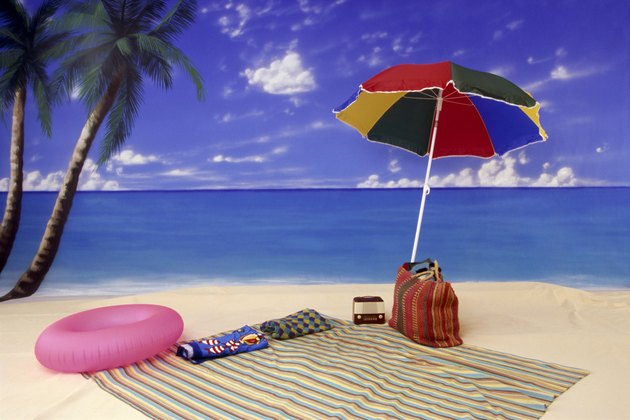Umbrella and blanket on beach