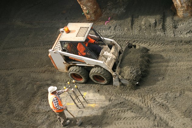 Bobcat and construction worker