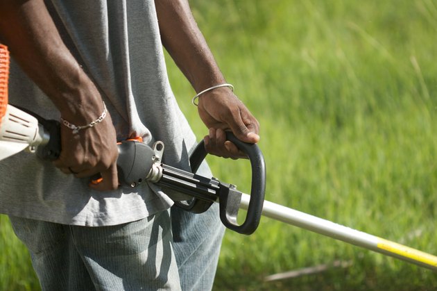 Gardener Mowing Lawn In The Caribbean