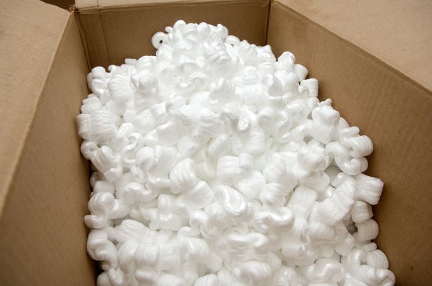 Open cardboard box with packing peanuts