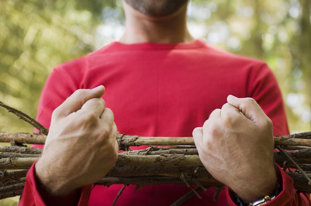 Man carrying sticks