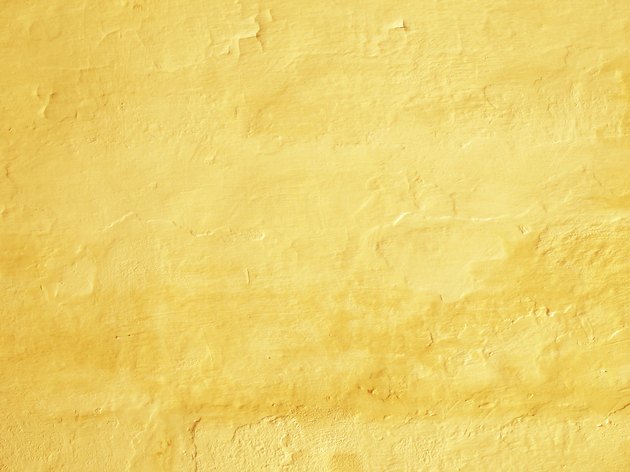 Vibrant yellow painted tuscany wall