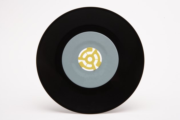 7-inch record with plastic 45-rpm adapter in center