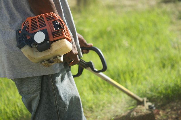 gardener mowing lawn in the caribbean