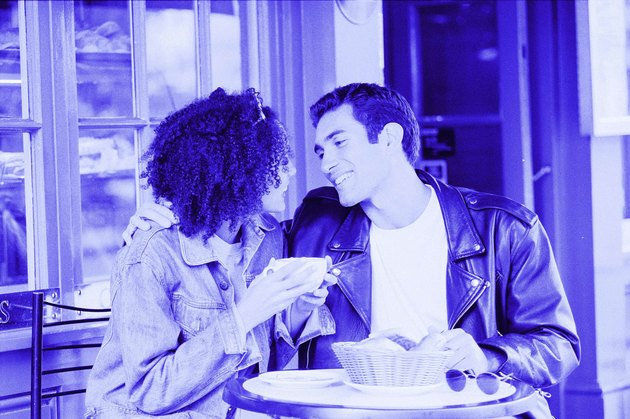 Hispanic male and African American female in cafe