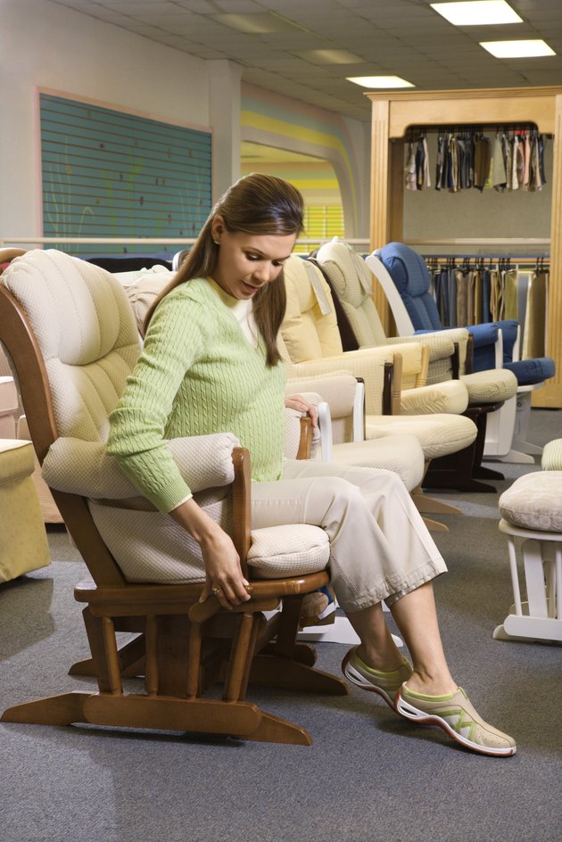 Pregnant woman sitting in a rocking chair