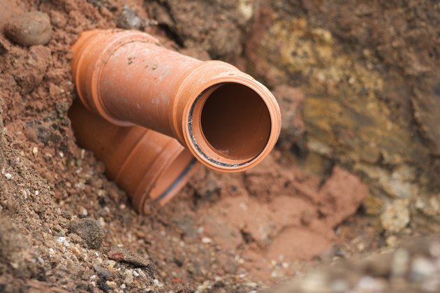 Sewer Pipe Being Installed In Ground