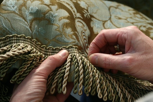 Sewing fringe to a drape