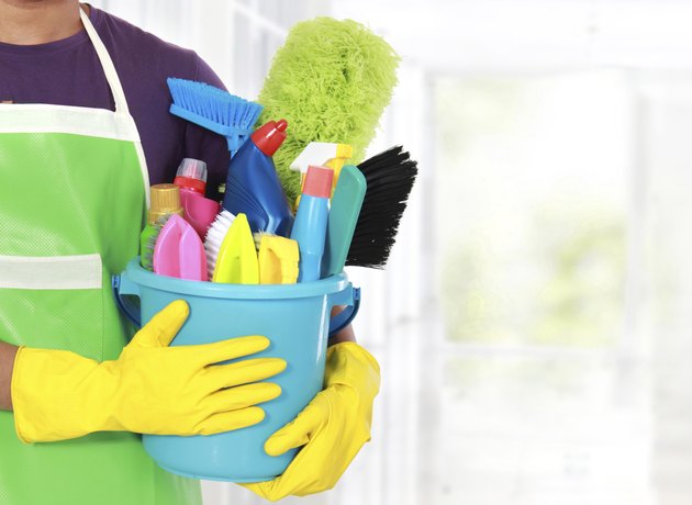 Portrait of man with cleaning equipment
