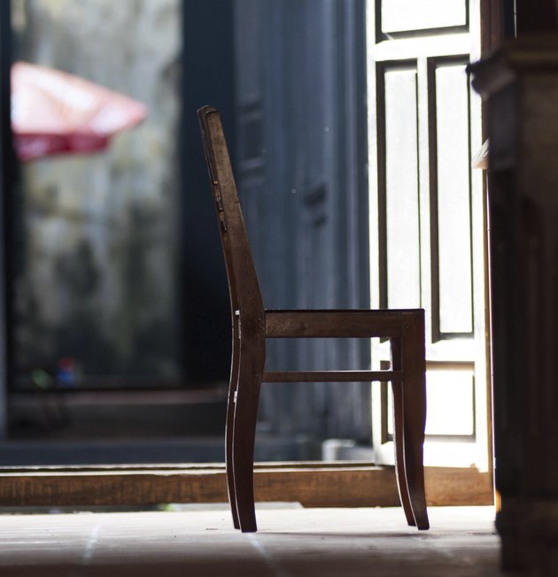 silhouette Old fashioned chair on wooden floor