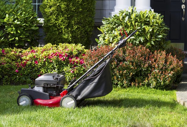 Old Lawnmower on Front Yard Ready for Work