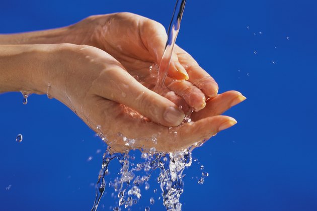 Hands under running water