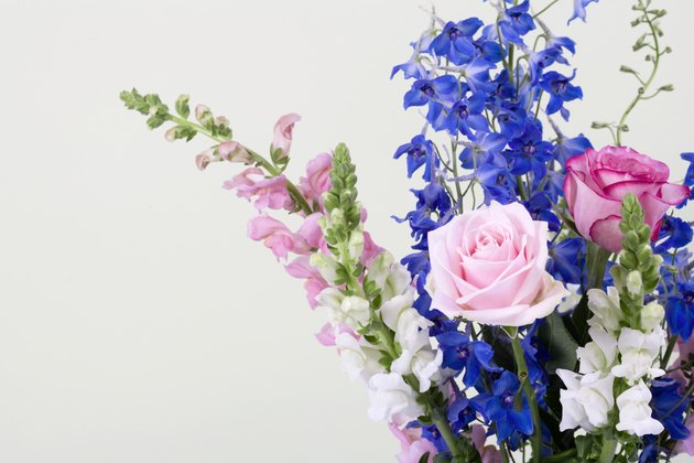 Delphinium, roses, and antirrhinum