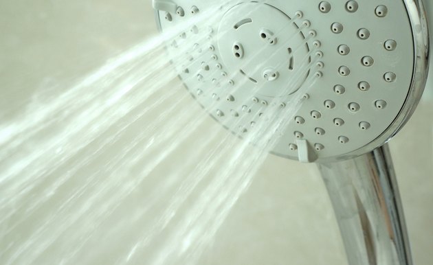 close up on head shower while running water