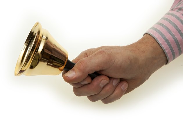 Hand with brass bell
