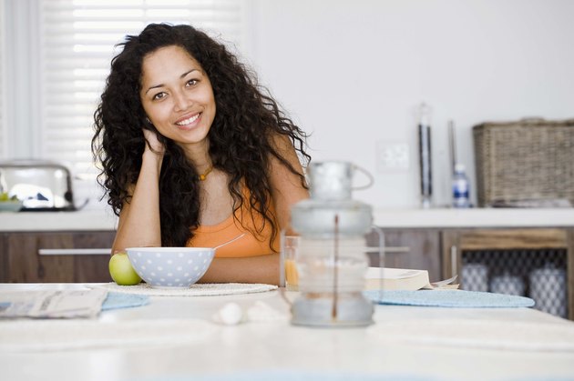 Woman smiling at kitchen table