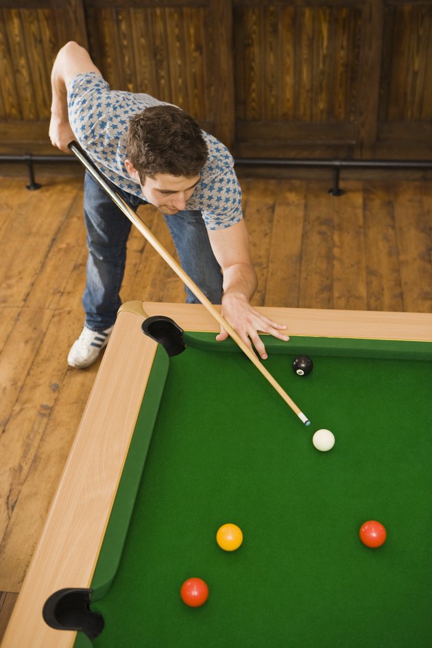 Man playing billiards