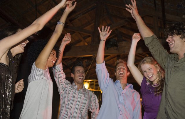 Friends dancing in nightclub