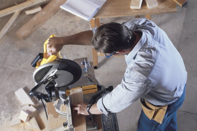 Construction worker using circular saw