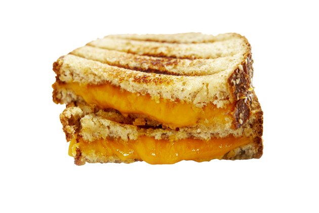 Two halves of grilled cheese sandwich