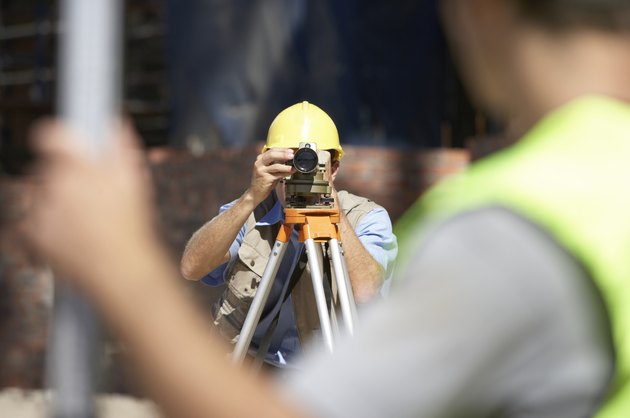 Surveyor Looking Through a Theodolite
