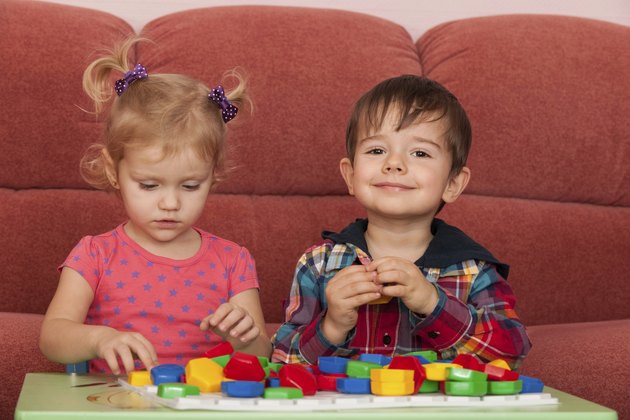 Two children playing at the table