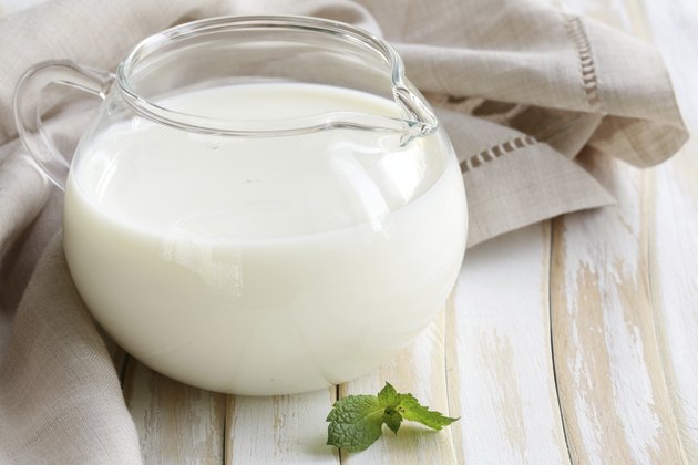 glass jug with milk, rustic style