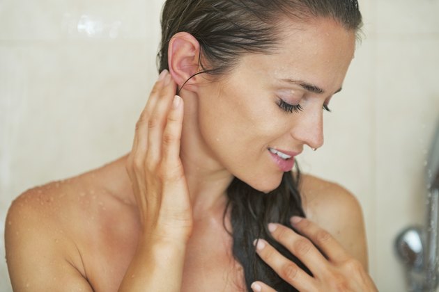 young woman washing in shower