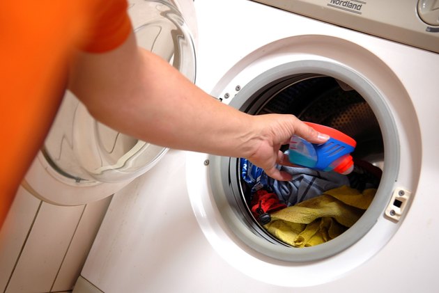 Taking out clean washing load