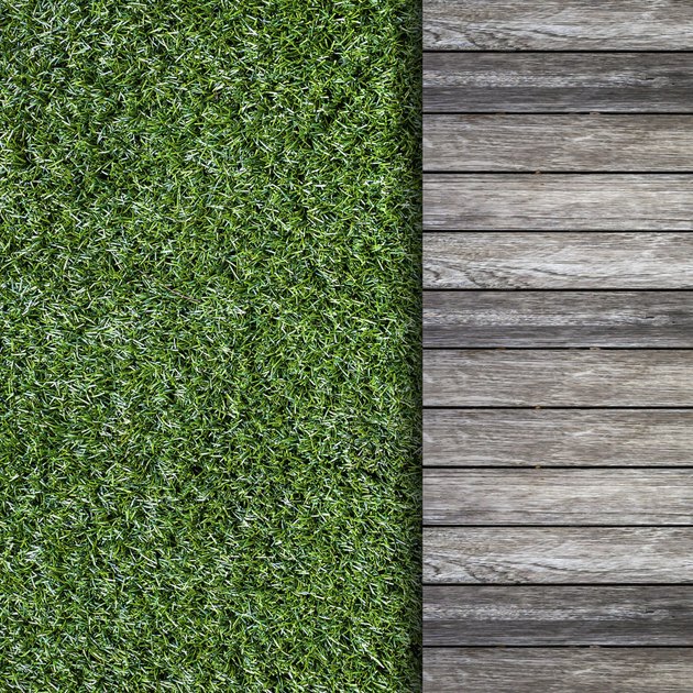 old wooden with green grass background