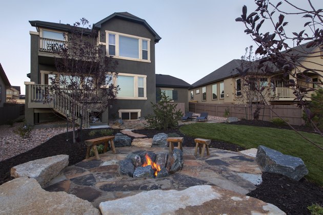 Landscaped backyard with beautiful Fire pit