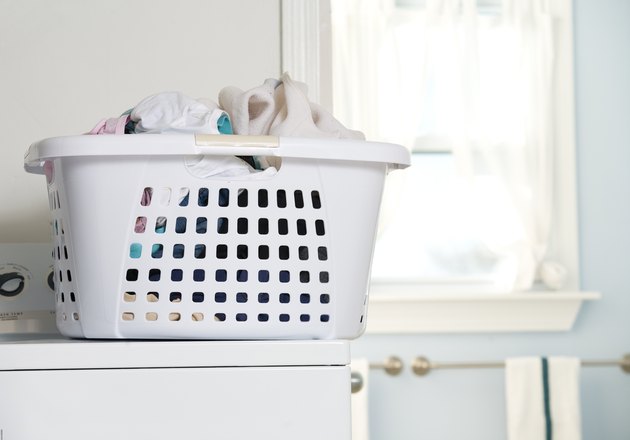 Basket of laundry on washing machine