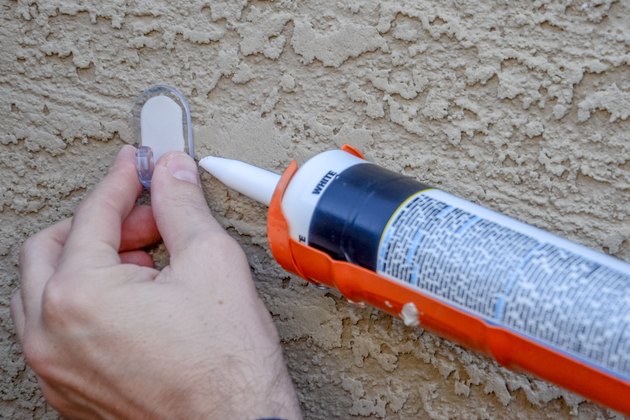 how-to-hang-christmas-lights-on-stucco-hunker