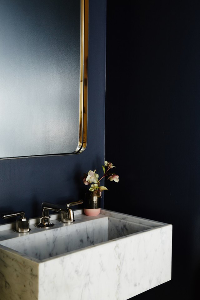 Marble and Brass Sink vanity on Black Vertical Shiplap Wall
