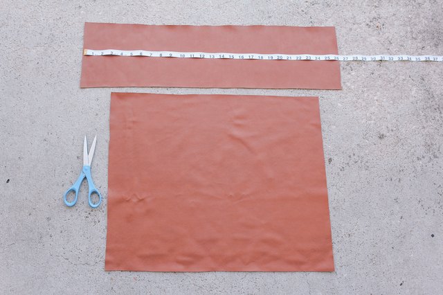 Faux leather fabric pieces cut out for chair back and seat