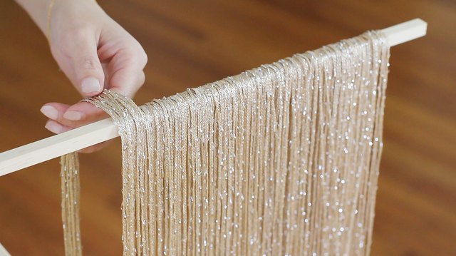 Draping strings over dowel